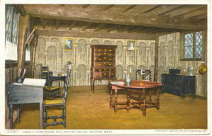 Postcard image of a Hall containing wallpaper on the walls and antique furniture.