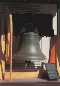 Large church bell suspended in a wooden frame